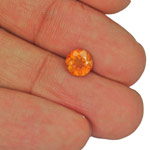 1.19-Carat 7mm Round Eye-Clean Yellowish Orange Clinohumite