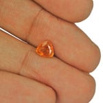 1.05-Carat Trilliant-Cut Deep Yellowish Orange Clinohumite