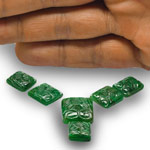 51.72-Carat 6-Pc Layout of Deep Green Carved Zambian Emeralds