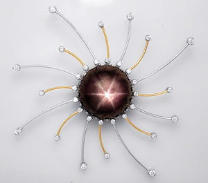 14K Gold Pendant mounted with a 35.44-Carat Black Star Sapphire & Diamonds